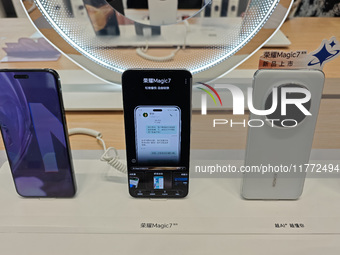 The newly released Maigic7 mobile phones are displayed at the Honor Mobile phone store in Shanghai, China, on November 13, 2024. (