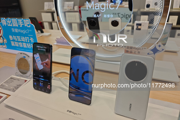 The newly released Maigic7 mobile phones are displayed at the Honor Mobile phone store in Shanghai, China, on November 13, 2024. 