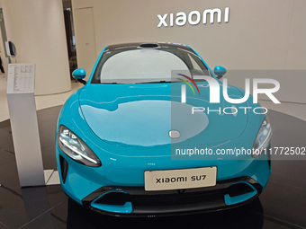 A Xiaomi SU7 car is displayed inside a Xiaomi store in Shanghai, China, on November 13, 2024. (