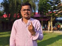 A voter shows his ink-marked finger after casting his ballot at a polling station during the Samaguri assembly constituency bypoll in Nagaon...