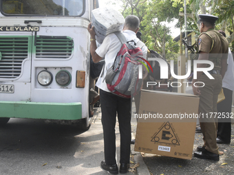 Polling officials carry election materials after collecting them from a distribution center in Colombo, Sri Lanka, on November 13, 2024, a d...