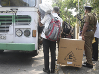 Polling officials carry election materials after collecting them from a distribution center in Colombo, Sri Lanka, on November 13, 2024, a d...