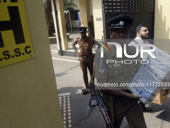 Polling officials carry election materials after collecting them from a distribution center in Colombo, Sri Lanka, on November 13, 2024, a d...