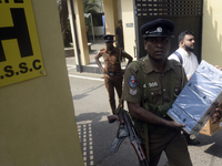 Polling officials carry election materials after collecting them from a distribution center in Colombo, Sri Lanka, on November 13, 2024, a d...