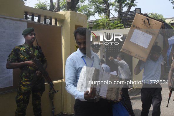 Polling officials carry election materials after collecting them from a distribution center in Colombo, Sri Lanka, on November 13, 2024, a d...