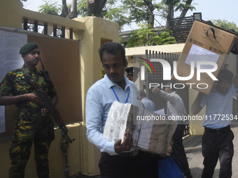 Polling officials carry election materials after collecting them from a distribution center in Colombo, Sri Lanka, on November 13, 2024, a d...