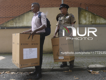 Polling officials carry election materials after collecting them from a distribution center in Colombo, Sri Lanka, on November 13, 2024, a d...