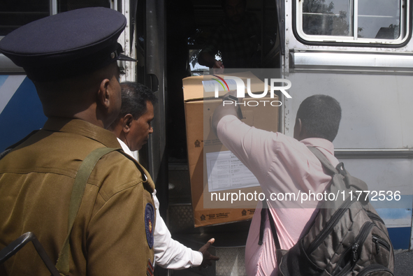 Polling officials carry election materials after collecting them from a distribution center in Colombo, Sri Lanka, on November 13, 2024, a d...