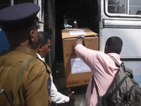 Polling officials carry election materials after collecting them from a distribution center in Colombo, Sri Lanka, on November 13, 2024, a d...