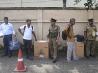 Polling officials carry election materials after collecting them from a distribution center in Colombo, Sri Lanka, on November 13, 2024, a d...