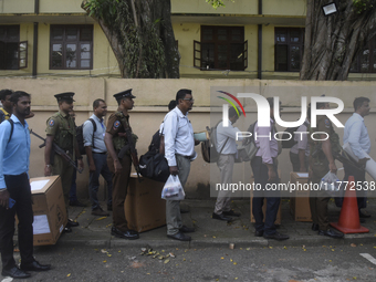 Polling officials carry election materials after collecting them from a distribution center in Colombo, Sri Lanka, on November 13, 2024, a d...