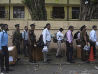 Polling officials carry election materials after collecting them from a distribution center in Colombo, Sri Lanka, on November 13, 2024, a d...