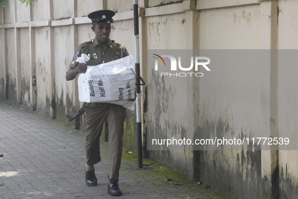 Polling officials carry election materials after collecting them from a distribution center in Colombo, Sri Lanka, on November 13, 2024, a d...