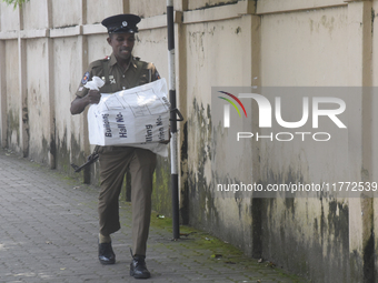 Polling officials carry election materials after collecting them from a distribution center in Colombo, Sri Lanka, on November 13, 2024, a d...