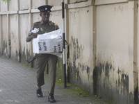 Polling officials carry election materials after collecting them from a distribution center in Colombo, Sri Lanka, on November 13, 2024, a d...