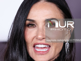 Demi Moore wearing Erdem arrives at the Los Angeles Premiere Of Paramount+'s Original Series 'Landman' Season 1 held at the Paramount Theatr...