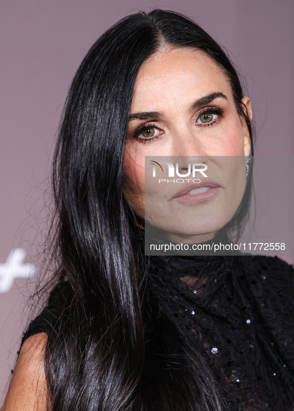 Demi Moore wearing Erdem arrives at the Los Angeles Premiere Of Paramount+'s Original Series 'Landman' Season 1 held at the Paramount Theatr...