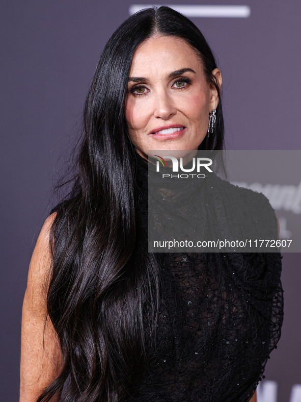 Demi Moore wearing Erdem arrives at the Los Angeles Premiere Of Paramount+'s Original Series 'Landman' Season 1 held at the Paramount Theatr...