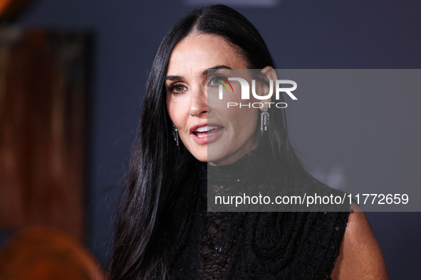 Demi Moore wearing Erdem arrives at the Los Angeles Premiere Of Paramount+'s Original Series 'Landman' Season 1 held at the Paramount Theatr...