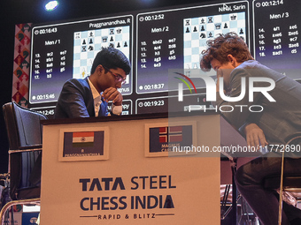 India's chess grandmaster Rameshbabu Praggnanandhaa and five-time world chess champion Magnus Carlsen of Norway face off in a rapid round of...