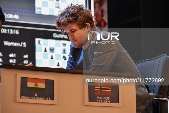 India's chess grandmaster Rameshbabu Praggnanandhaa and five-time world chess champion Magnus Carlsen of Norway face off in a rapid round of...