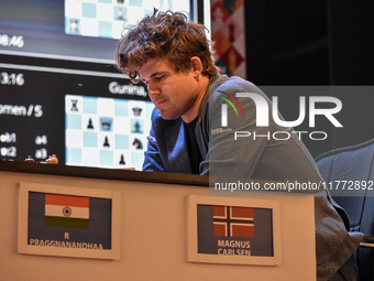 India's chess grandmaster Rameshbabu Praggnanandhaa and five-time world chess champion Magnus Carlsen of Norway face off in a rapid round of...