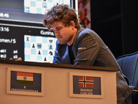 India's chess grandmaster Rameshbabu Praggnanandhaa and five-time world chess champion Magnus Carlsen of Norway face off in a rapid round of...