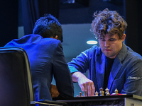 India's chess grandmaster Rameshbabu Praggnanandhaa and five-time world chess champion Magnus Carlsen of Norway face off in a rapid round of...