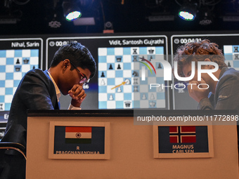 India's chess grandmaster Rameshbabu Praggnanandhaa and five-time world chess champion Magnus Carlsen of Norway face off in a rapid round of...