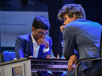 India's chess grandmaster Rameshbabu Praggnanandhaa and five-time world chess champion Magnus Carlsen of Norway face off in a rapid round of...