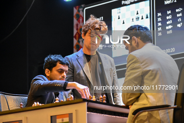 Five-time world chess champion Magnus Carlsen of Norway watches other players' games during the rapid round of the 6th TATA Steel chess comp...