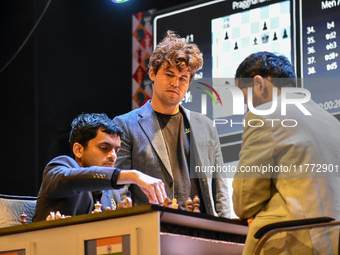 Five-time world chess champion Magnus Carlsen of Norway watches other players' games during the rapid round of the 6th TATA Steel chess comp...