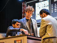 Five-time world chess champion Magnus Carlsen of Norway watches other players' games during the rapid round of the 6th TATA Steel chess comp...