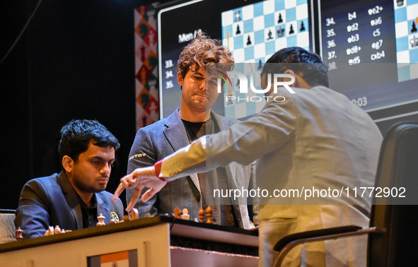 Five-time world chess champion Magnus Carlsen of Norway watches other players' games during the rapid round of the 6th TATA Steel chess comp...