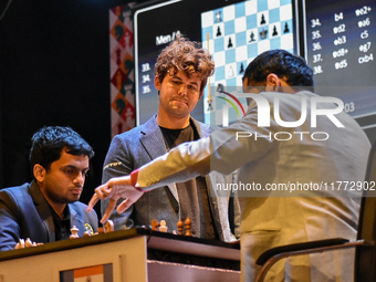 Five-time world chess champion Magnus Carlsen of Norway watches other players' games during the rapid round of the 6th TATA Steel chess comp...