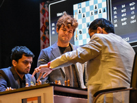 Five-time world chess champion Magnus Carlsen of Norway watches other players' games during the rapid round of the 6th TATA Steel chess comp...