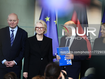 German Chancellor Olaf Scholz receives the Annual Report from the Council of Economic Experts at the Chancellery in Berlin, Germany, on Nove...