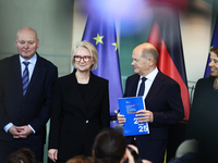 German Chancellor Olaf Scholz receives the Annual Report from the Council of Economic Experts at the Chancellery in Berlin, Germany, on Nove...