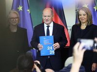 German Chancellor Olaf Scholz receives the Annual Report from the Council of Economic Experts at the Chancellery in Berlin, Germany, on Nove...