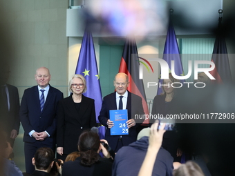 German Chancellor Olaf Scholz receives the Annual Report from the Council of Economic Experts at the Chancellery in Berlin, Germany, on Nove...