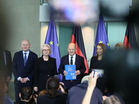 German Chancellor Olaf Scholz receives the Annual Report from the Council of Economic Experts at the Chancellery in Berlin, Germany, on Nove...