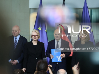 German Chancellor Olaf Scholz receives the Annual Report from the Council of Economic Experts at the Chancellery in Berlin, Germany, on Nove...