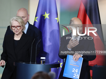 German Chancellor Olaf Scholz receives the Annual Report from the Council of Economic Experts at the Chancellery in Berlin, Germany, on Nove...