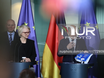 German Chancellor Olaf Scholz receives the Annual Report from the Council of Economic Experts at the Chancellery in Berlin, Germany, on Nove...