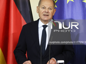 German Chancellor Olaf Scholz receives the Annual Report from the Council of Economic Experts at the Chancellery in Berlin, Germany, on Nove...