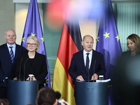 German Chancellor Olaf Scholz receives the Annual Report from the Council of Economic Experts at the Chancellery in Berlin, Germany, on Nove...