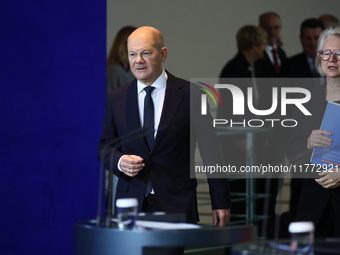 German Chancellor Olaf Scholz receives the Annual Report from the Council of Economic Experts at the Chancellery in Berlin, Germany, on Nove...