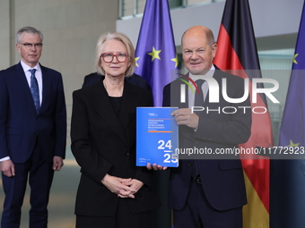 German Chancellor Olaf Scholz receives the Annual Report from the Council of Economic Experts at the Chancellery in Berlin, Germany, on Nove...