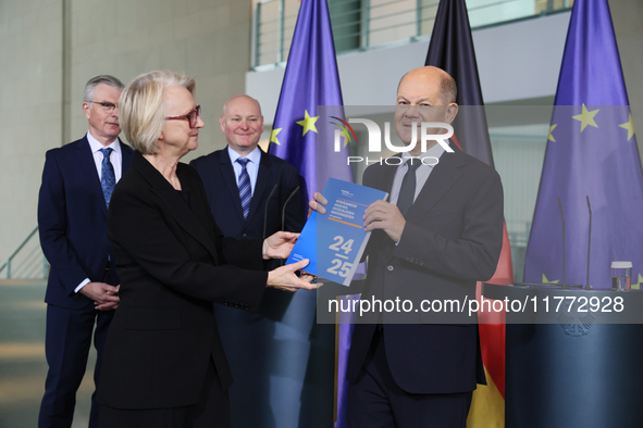 German Chancellor Olaf Scholz receives the Annual Report from the Council of Economic Experts at the Chancellery in Berlin, Germany, on Nove...