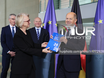 German Chancellor Olaf Scholz receives the Annual Report from the Council of Economic Experts at the Chancellery in Berlin, Germany, on Nove...